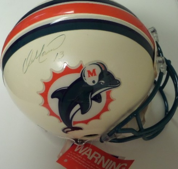 This full size Miami Dolphins ON FIELD Authentic football helmet from Riddell comes sharpie signed by the Hall Of Fame stat monster QB!  The signature grades a lighter but still legible 6, and this gorgeous display helmet books in the high hundreds!  Great Dolphins HOF item!