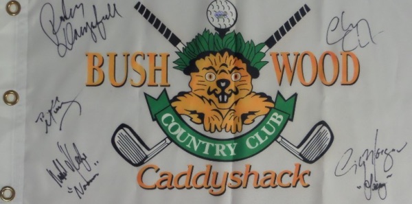 This white "Bushwood Country Club" pin flag from the movie Caddyshack has been black marker signed by 5 cast members, including Chevy Chase, Bill Murray, Michael O'Keefe, Cindy Morgan, and the late Rodney Dangerfield.  All signatures grade 9's or better on this piece that is a must have for fans of the classic comedy, and values into the high hundreds and nice! A few even included their character names!