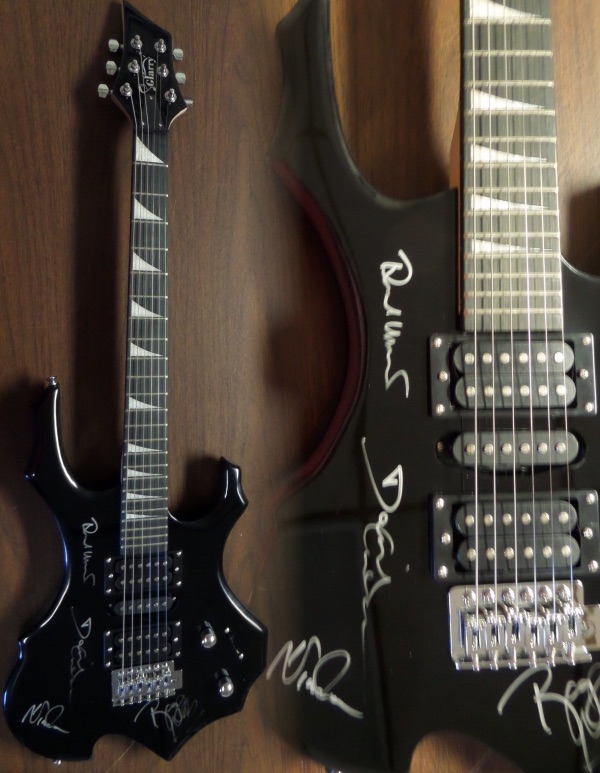 This mint black GORGEOUS electric beauty comes in the original box with all accessories included. It is STUNNING and comes signed in silver by ROGER WATERS, DAVID GILMOUR, RICHARD WRIGHT, & NICK MASON!  All of the autographs are in great shape and this retails well into the low thousands from 1 of classic rocks all time great bands. 