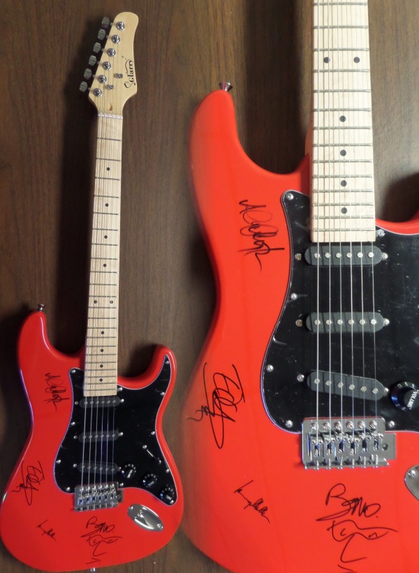 This STUNNING mint red electric beauty comes in box with original carry bag, straps,etc.  It comes signed perfectly by ALL 4 guys with a great personal portrait of his face by Bono.  Also included are Adam Clayton, Larry Mullen Jr. & the Edge.  Guaranteed authentic and retails into the thousands easily.