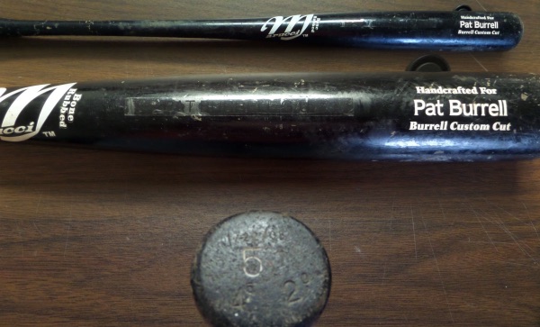 This 34" long black bat from Marucci was used in actual Philadelphia Phillies MLB action by their former #1 overall pick, Pat Burrell.  It is in VG+ shape with cracking, denting and ball marks all evident, reading Handcrafted For Pat Burrell Burrell Custom Cut right on the barrel, and Burrell's number 5 etched into the knob, as well as a 1/22/08 date, which MEANS that this baby was used during the Phils' World Series Season.  A MUST for Phils collectors!