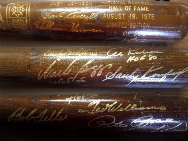 This limited edition (343/500) brown Louisville Slugger bat commemorates the 1975 HOF Induction, with the facsimile signatures of the Inductees etched in gold into the barrel, but that's not all!  It is also hand-signed in GOLD by 7 all time greats, including Pete Rose, Bob Feller, Sandy Koufax, Wade Boggs, Al Kaline, Harmon Killebrew and Ted Williams!  WOW!!!  A stunning display piece, and, with 5 of the 7 now deceased, and Pete unbanned and ready to enter the Halls of Cooperstown, retail is low thousands!