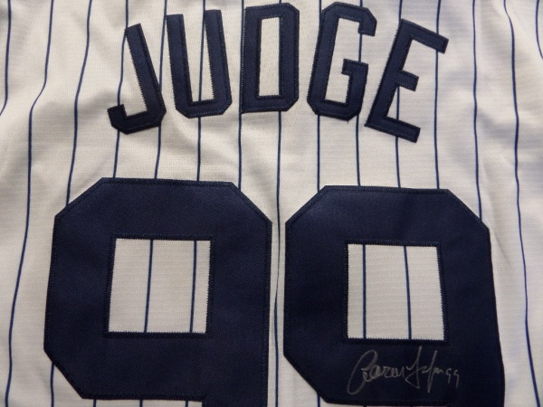This home white gem is authentic and mint!  It comes signed on the back #99 in silver by this homerun-hitting slugger who ran away with the HR crown a few years ago (and MVP).  Guaranteed authentic and retail is into the low thousands and rising as they made it to the World Series this past year and are primed for a run again! He is the MVP favorite this year already!