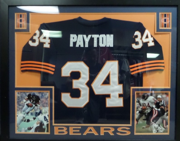 This HUGE 36"x45" piece comes professionally framed and ready to display.  It will be super expensive to ship, so much cheaper if local buyer can pick up.  It contains a signed vintage authentic-style Bears jersey with his yards inscription included. Unfortunately, the signature is very faded over the years!  Comes with a COA from World Class Collectibles for authenticity and ideal for any Bears fans wall! 