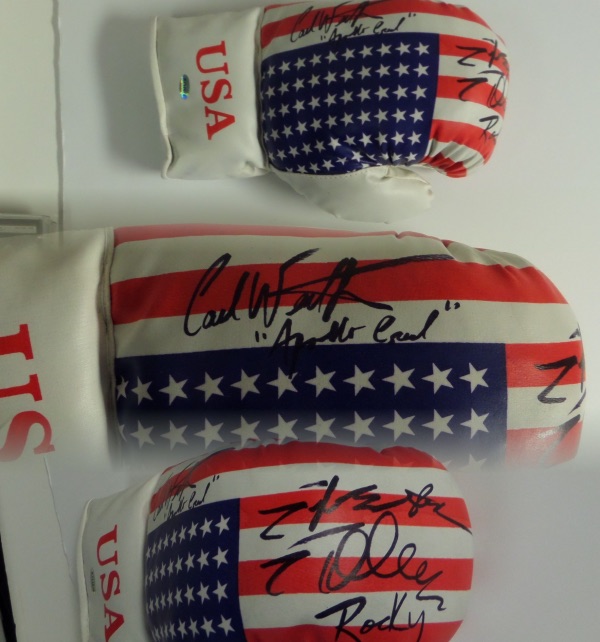 This mint USA flag 14 ounce lace-up glove comes signed by the 2 stars of this all-time classic flick. Both have signed wonderfully in black with Carl including "Apollo Creed" and Stallone "Rocky"!!  Retail was in the mid hundreds and now rising with the passing of Carl Weathers.  Hologrammed and guaranteed authentic. 