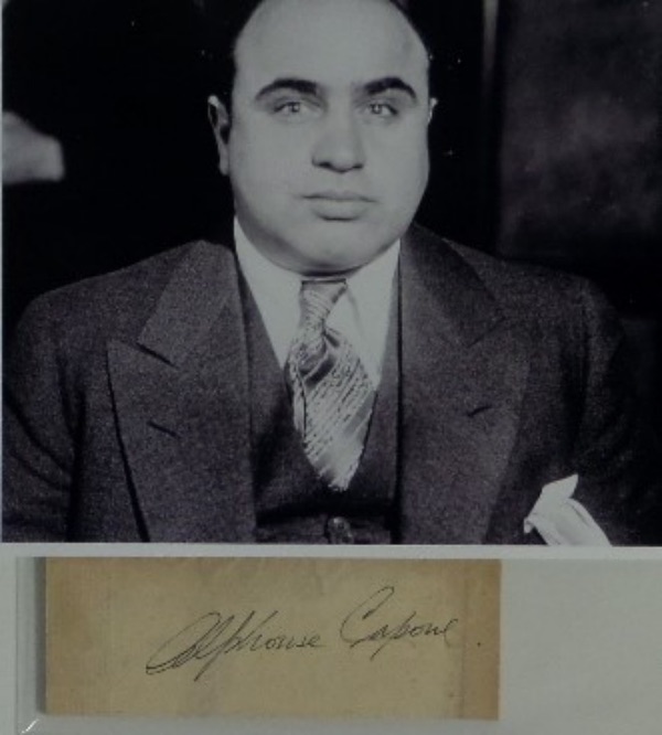 This 2x4.5 cut of thick stock features a black ink signature from 1920's crime boss, Al Capone.  The signature grades an overall 5-5.5, and the cut comes with a black and white photo for matting and framing!  With Capone gone now more than 75 years, retail is low thousands!