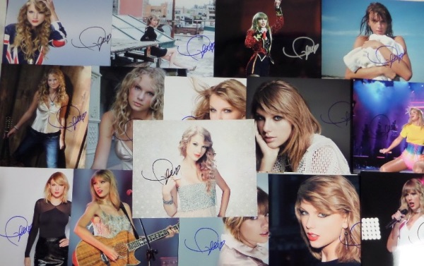 This ideal group lot is FIFTEEN full color 8x10 photos, including different shots, each hand-signed by the superstar pop/country singer.  Each photo can retail into the hundreds with the huge popularity of Swift, so you do the math with FIFTEEN!!!