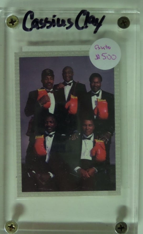 This special "Champions Forever" boxing card is slabbed in NM condition, and is a color image of five of the greatest Heavyweight Champions of all time.  It is hand-signed in black ink by the greatest of the greatest, Muhammad Ali, but here, he has signed Cassius Clay, and the signature is, admittedly, difficult to see, grading about a 3.  Comes with a TRISTAR COA on the reverse of the card, and retail is low thousands, even with a light autograph!