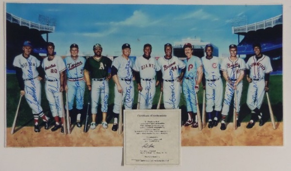 This super panoramic image is about 12x20 in size, shows all 11 HOF sluggers posing inside Yankee Stadium, and in their vintage uniforms. It is a treasure, done at that 1989 AC show by artist Ron Lewis, and comes one color blue sharpie signed by everyone! It grades a clean 9 or so overall and, is signed by the likes of Mantle, Mays, Aaron, Reggie, Ted Williams, Banks, Schmidt and many more! 