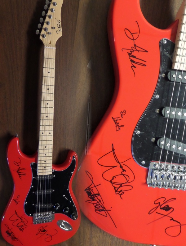 Wow, this mint and great-looking red strat-style electric guitar comes signed 5 of the longtime members of this amazing rock band. The signatures all show off wonderfully on this gorgeous guitar and included are JOE WALSH, GLENN FREY (deceased), DON HENLEY, TIMOTHY SCHMIT, & DON FELDER!!  Very rare with Frey's signature and retails into the thousands easily. Guaranteed authentic. 